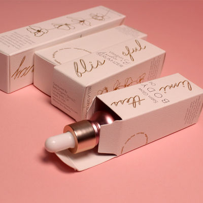 Boîte de bouteille de lotion personnalisée avec une texture rose et blanche de luxe